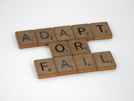 scrabble tiles spelling adapt or fail